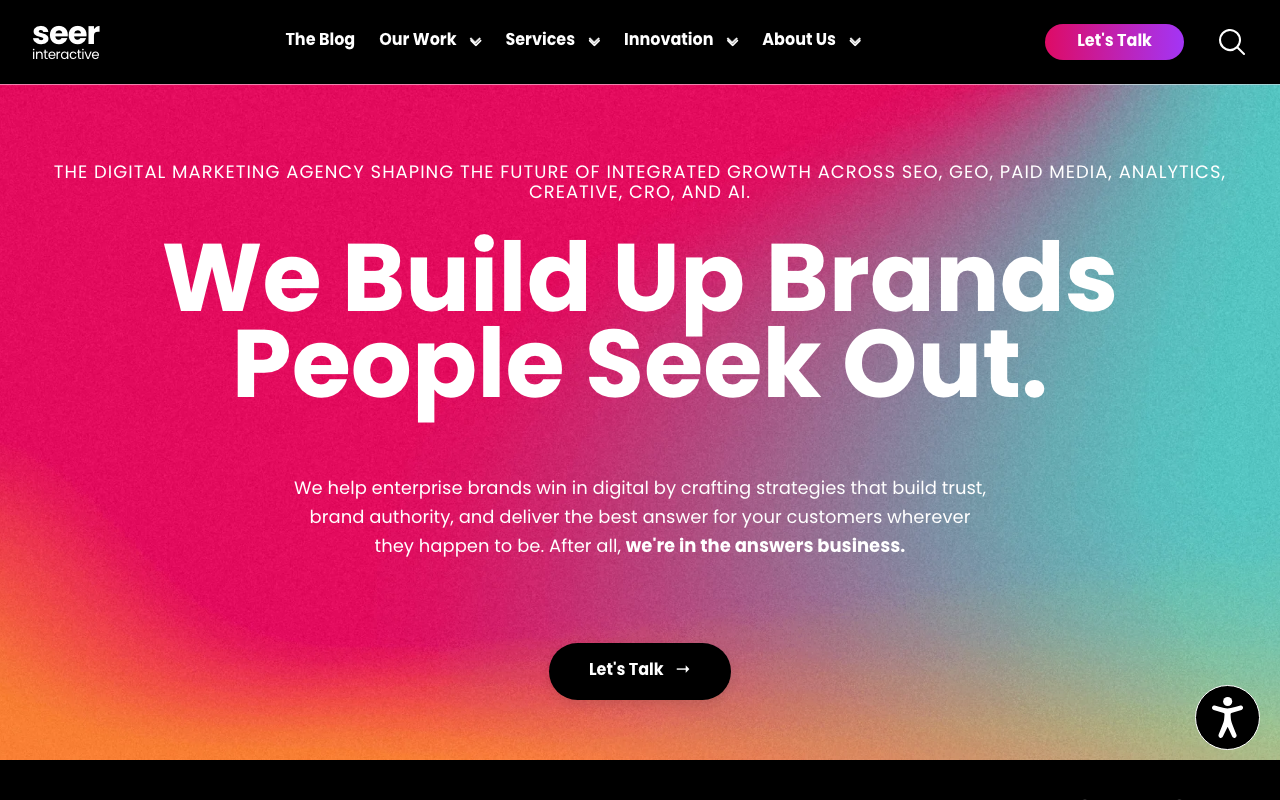 Seer Interactive homepage with the headline “We Build Up Brands People Seek Out” on a colorful gradient background.